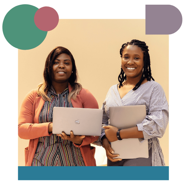 Two women standing side by side, smiling and holding laptops. One wears a striped shirt and pink cardigan, the other a striped blouse. Geometric shapes decorate the corners of the image.